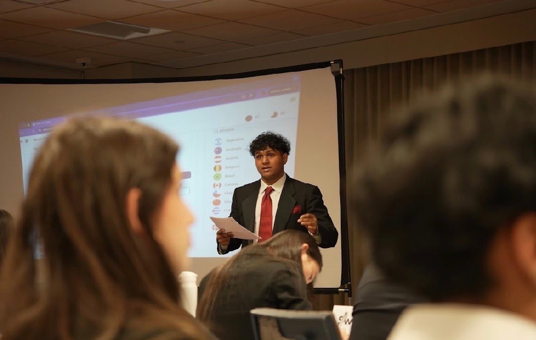 A photo of Vedant presenting to a room in Toronto