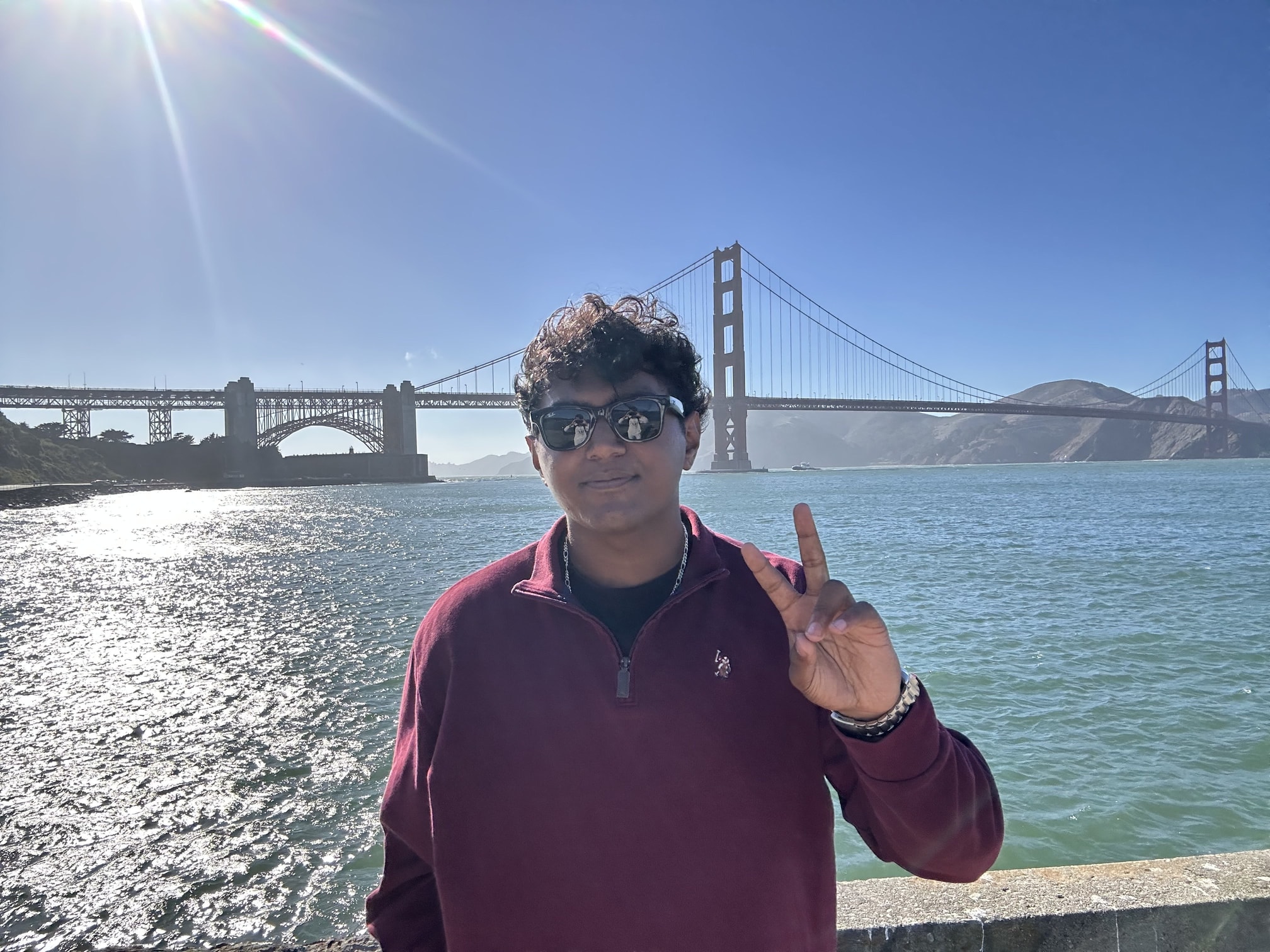 A photo of Vedant in front of the Golden Gate Bridge in San Francisco